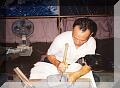 An inkstone carver. Inkstones are used to hold ink for calligraphy.